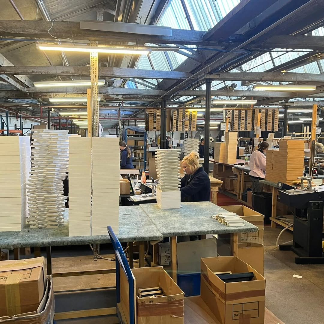 British frame production facility with team handcrafting wooden frames for Skylit Studio prints – proudly made in the UK by a local company.