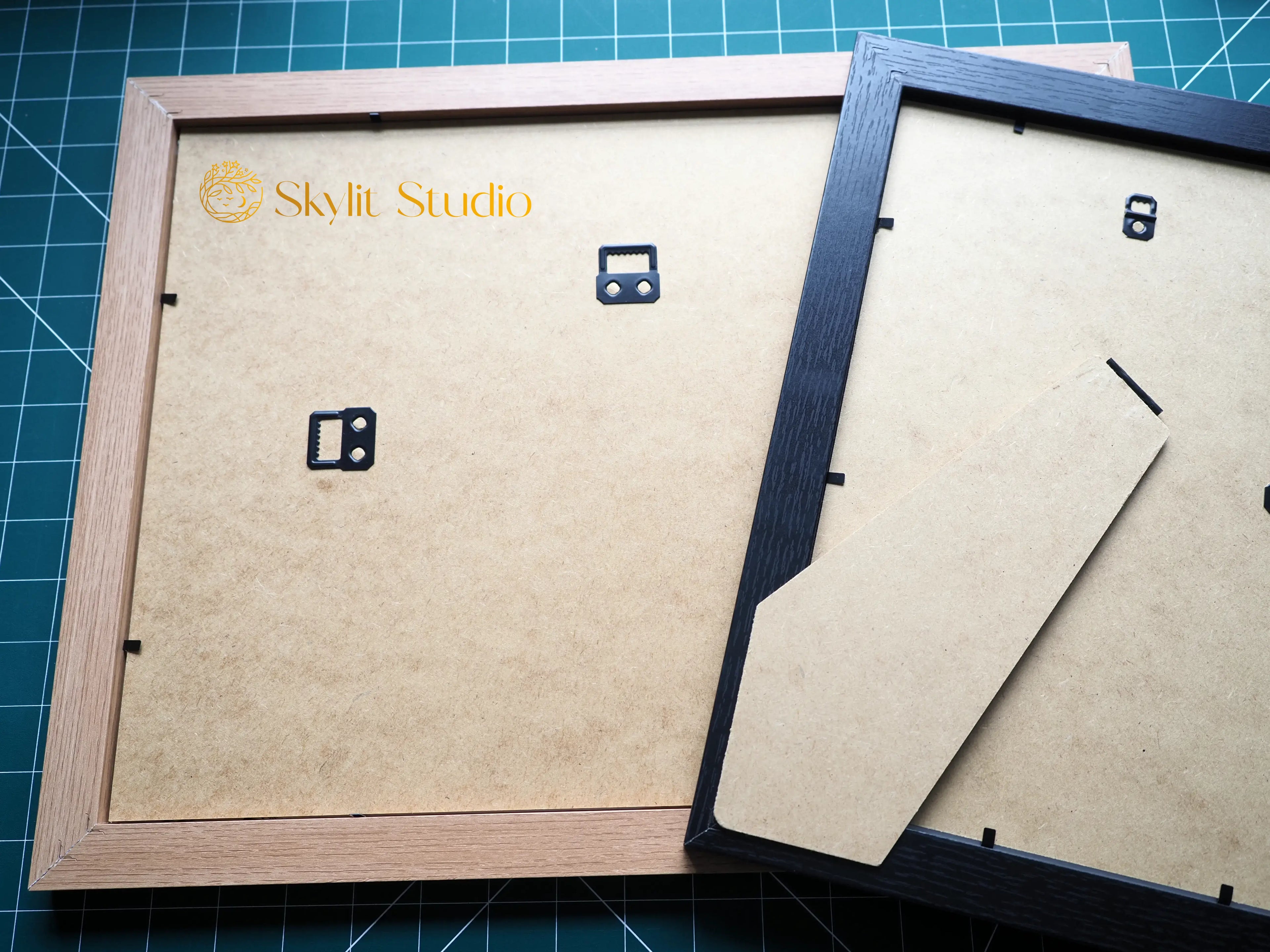 High-quality wooden photo frames in natural brown and black finishes, designed for displaying Skylit Studio&