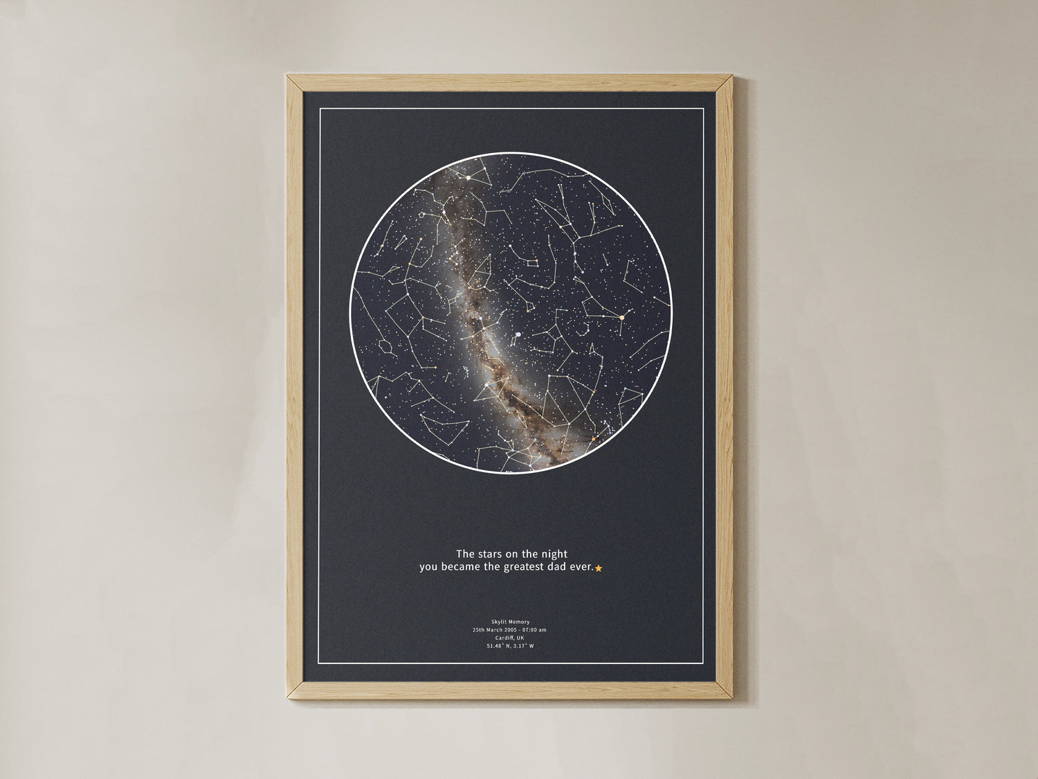 Framed personalised star map print with constellation lines and Milky Way detail on a deep navy background, featuring the quote ‘The stars on the night you became the greatest dad ever’, displayed on a beige wall – custom gift by Skylit Studio.