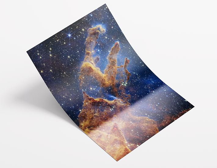 Rolled celestial print of the Pillars of Creation nebula on lustre photo paper, showcasing Skylit Studio’s premium pigment-based printing and rich cosmic detail.
