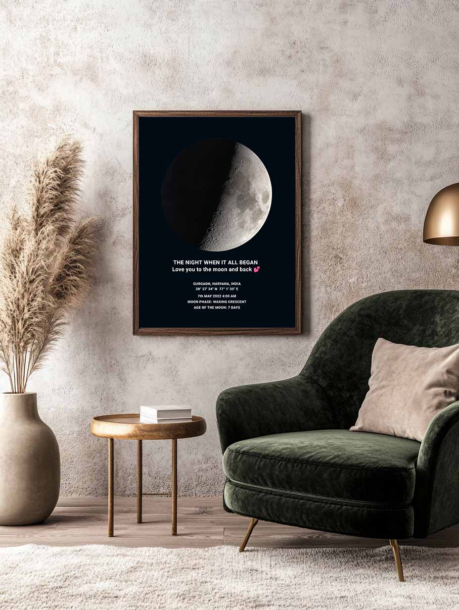 Framed moon phase artwork with romantic quote, mounted on a textured wall above a velvet armchair and wood-accent furniture – perfect home décor piece by Skylit Studio.