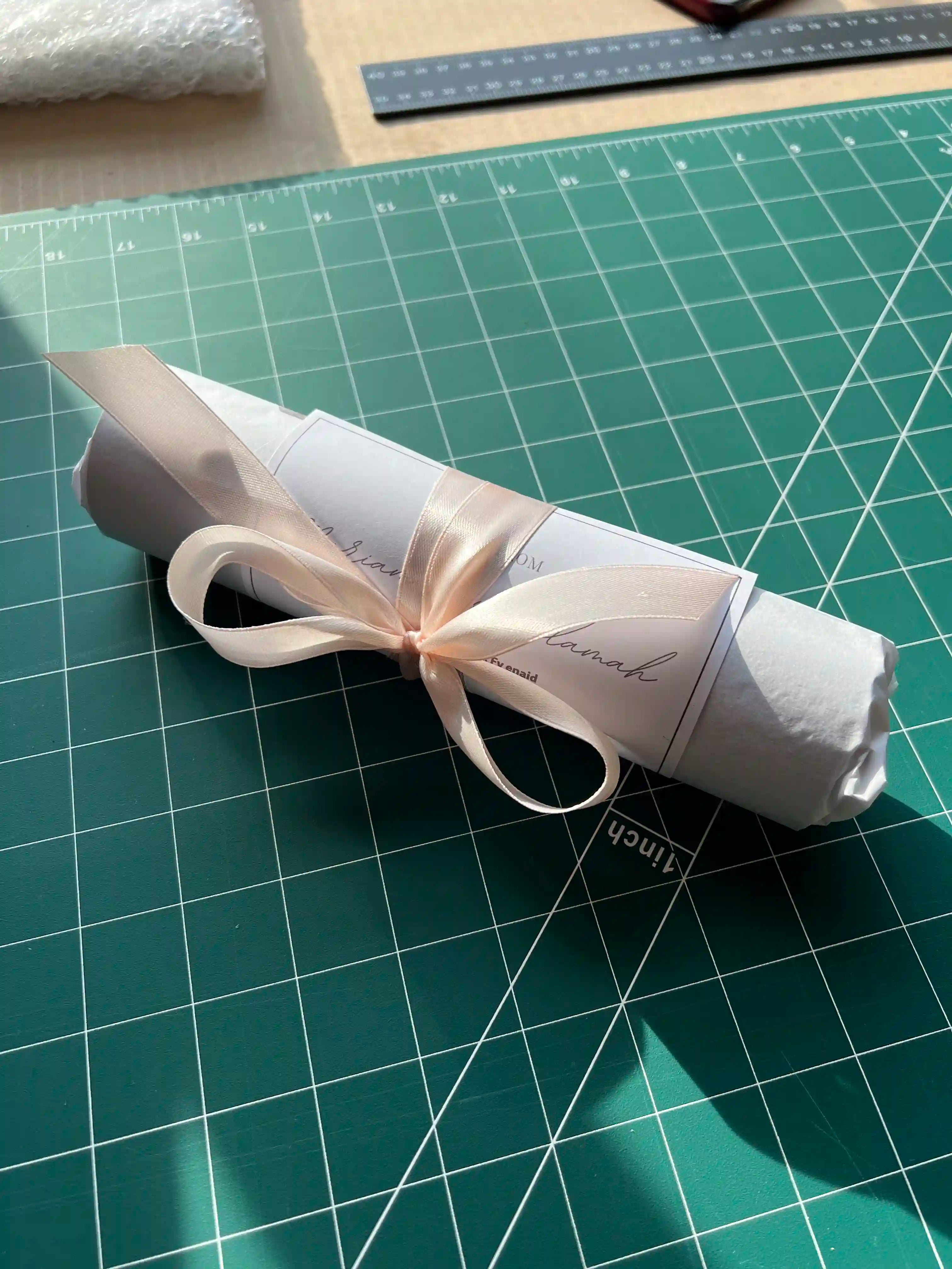 A beautifully rolled and wrapped personalised star map print from Skylit Studio, secured with a soft satin ribbon and a custom gift tag. This elegant packaging adds a luxurious touch, making it a perfect gift for special occasions such as anniversaries, weddings, or birthdays.