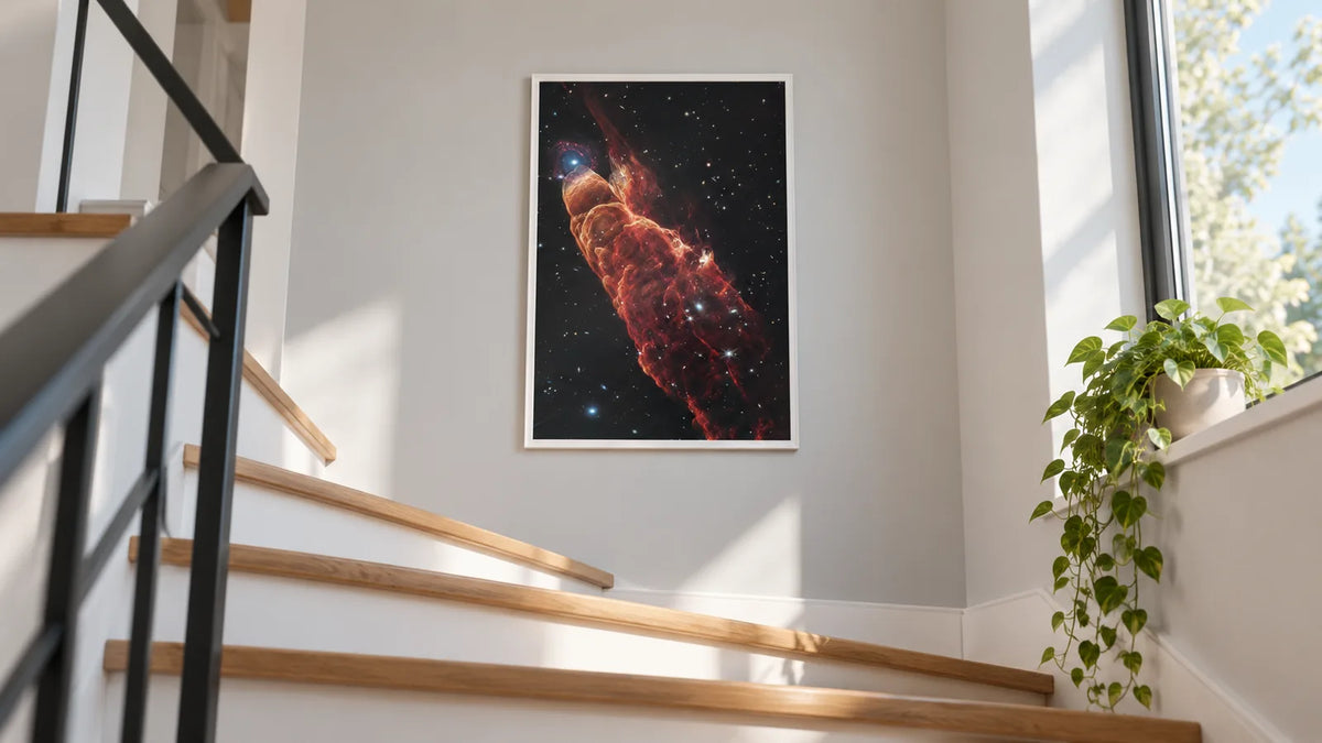 Framed Herbig-Haro 49/50 deep sky print in a white frame on a bright staircase landing in morning light