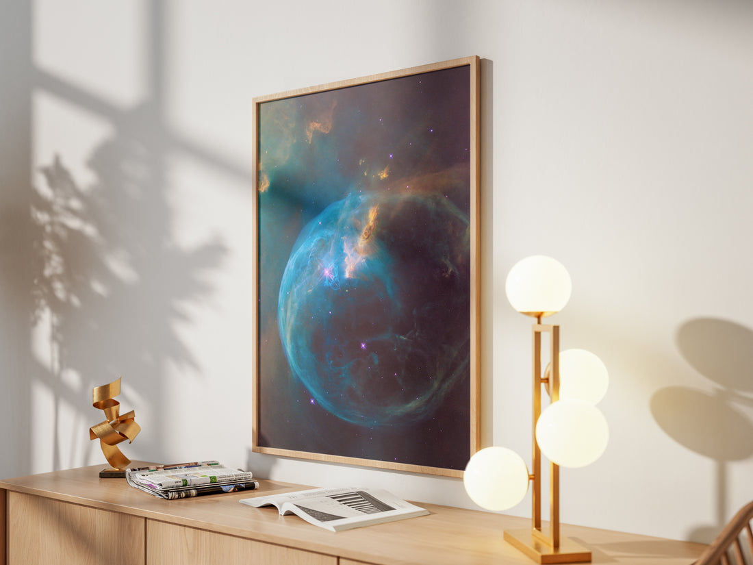 Framed Bubble Nebula print by Skylit Studio on a sideboard in a bright living room