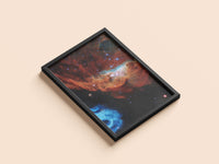 Cosmic Reef print in a black frame, flat lay