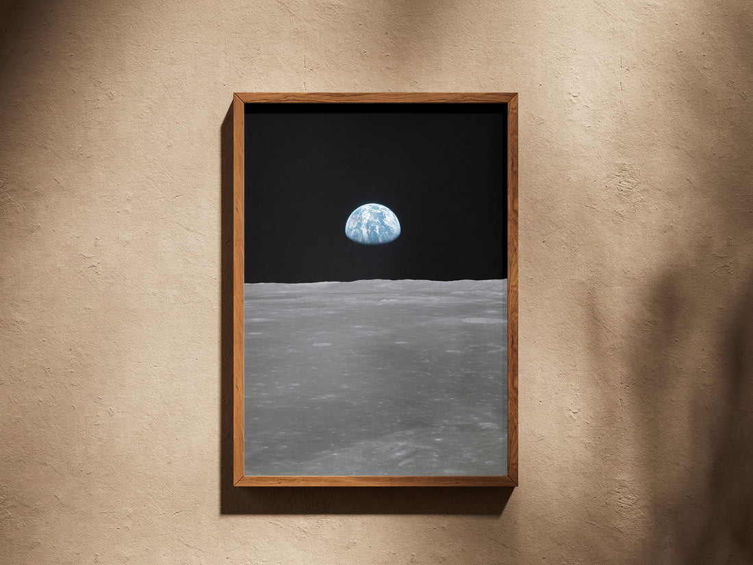 Earth on the Horizon print in a wooden frame on a plaster wall