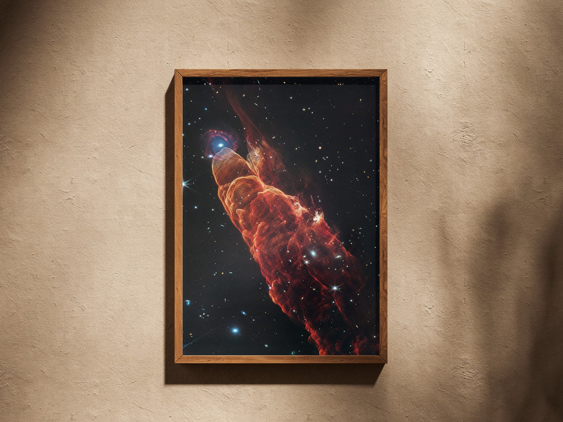 Herbig-Haro 49/50 print in a wooden frame on a plaster wall