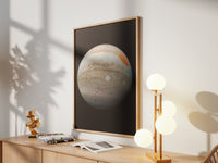 Framed Jupiter print by Skylit Studio on a sideboard in a bright living room
