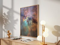 Framed Lagoon Nebula print by Skylit Studio on a sideboard in a bright living room
