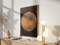Framed Mars print by Skylit Studio on a sideboard in a bright living room