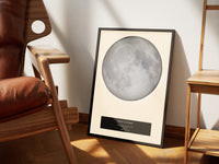 Cream boxed moon map leaning on a leather chair