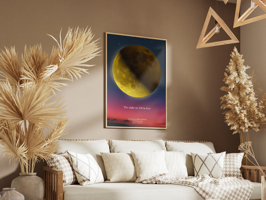 Personalised moon map print in a natural frame above a sofa