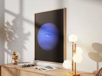 Framed Neptune print by Skylit Studio on a sideboard in a bright living room
