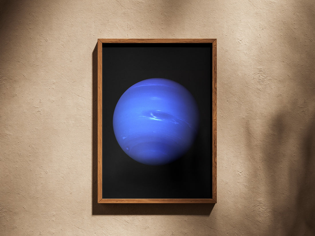 Neptune print in a wooden frame on a plaster wall