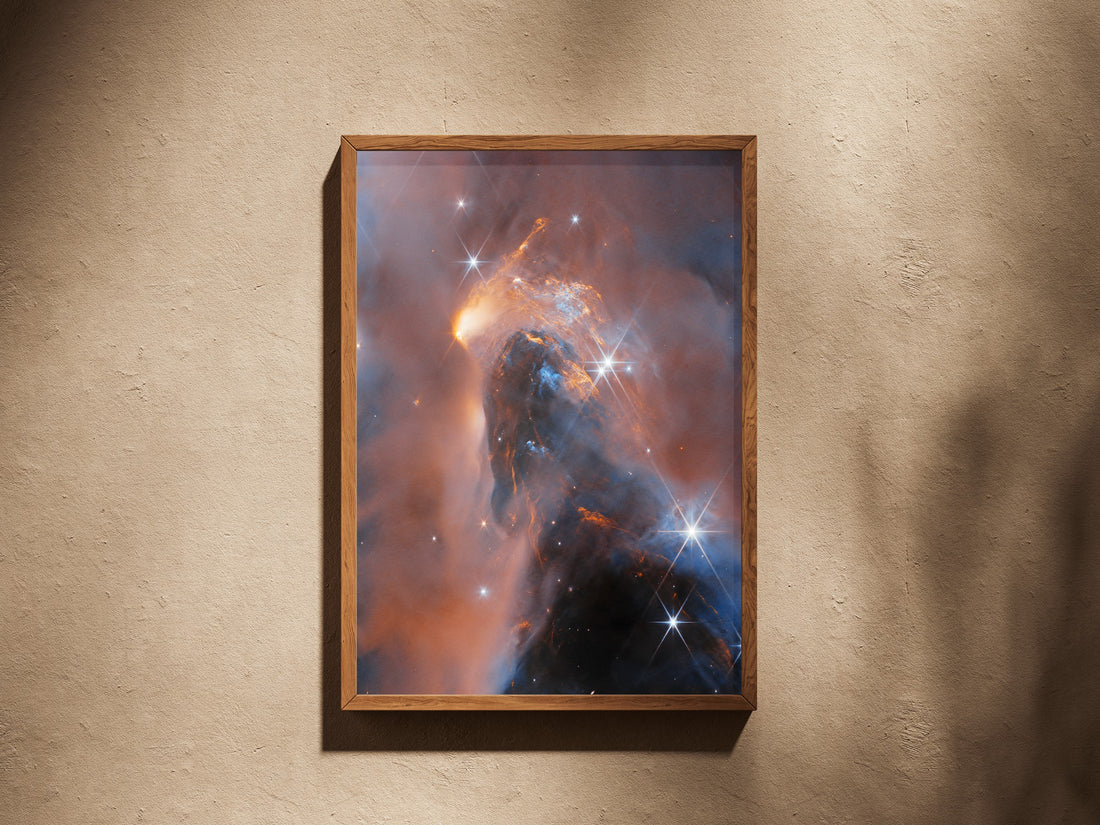NGC 1333 Perseus print in a wooden frame on a plaster wall