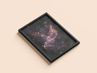 NGC 346 print in a black frame, flat lay