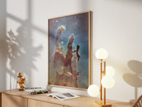 Framed Pillars of Creation (Hubble) print by Skylit Studio on a sideboard in a bright living room