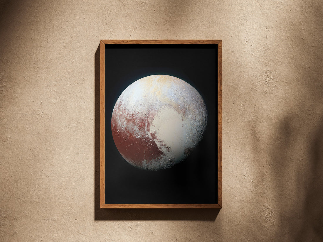 Pluto print in a wooden frame on a plaster wall
