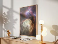 Framed Rho Ophiuchi print by Skylit Studio on a sideboard in a bright living room