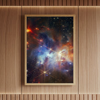 Cosmic wall art print of the Serpens star-forming region in vivid colour, framed in oak and mounted on a designer wooden panelled wall – celestial interior art by Skylit Studio.