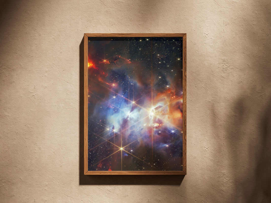 Serpens Nebula print in a wooden frame on a plaster wall