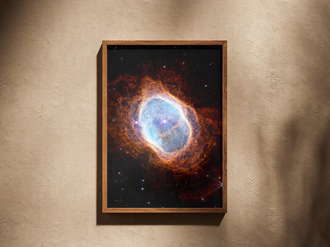 Southern Ring Nebula print in a wooden frame on a plaster wall