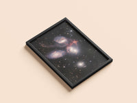 Stephan's Quintet print in a black frame, flat lay