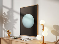 Framed Uranus print by Skylit Studio on a sideboard in a bright living room