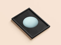 Uranus print in a black frame, flat lay