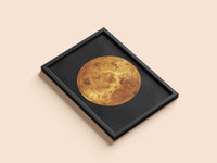Venus print in a black frame, flat lay