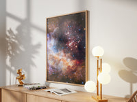 Framed Westerlund 2 print by Skylit Studio on a sideboard in a bright living room