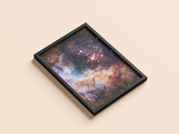 Westerlund 2 print in a black frame, flat lay