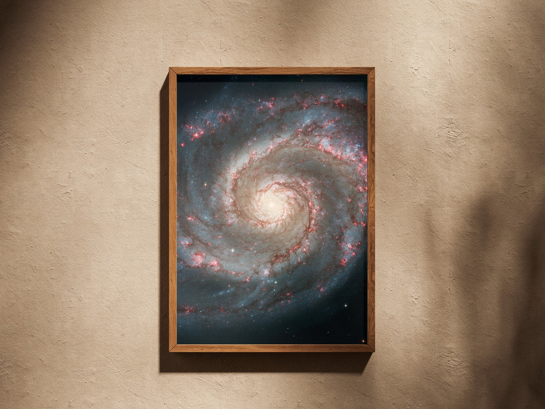 Whirlpool Galaxy print in a wooden frame on a plaster wall