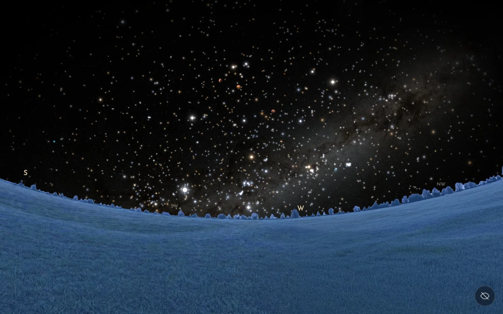 The Milky Way arching as a band of light over a moonlit landscape in the Skylit Studio Night Sky Explorer